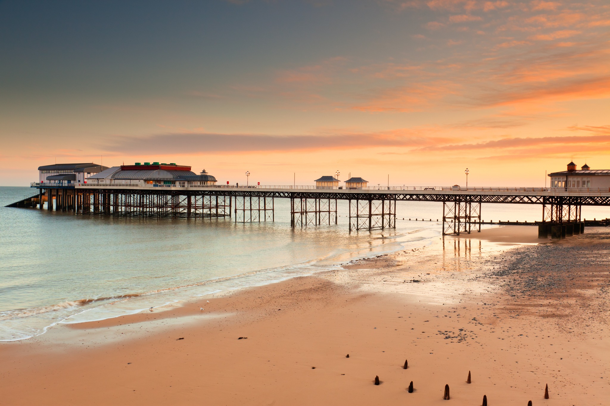 Pier sunset golden hour atmospheric seaside light