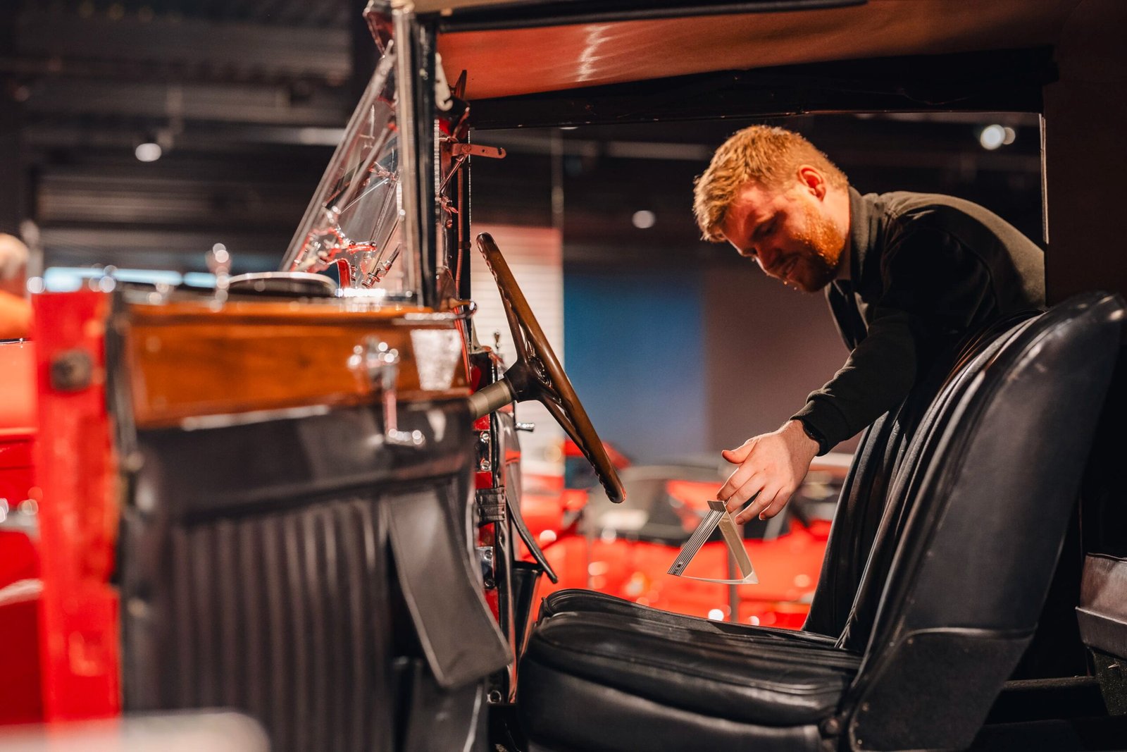 Restoration workshop mechanics at work vintage vehicle