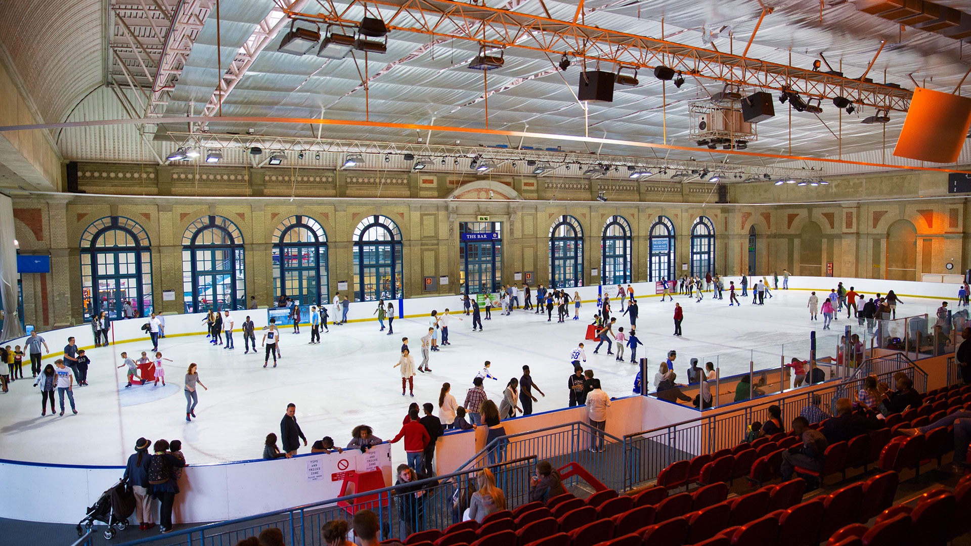 Skaters on the indoor ice rink at Alexandra Palace in North London