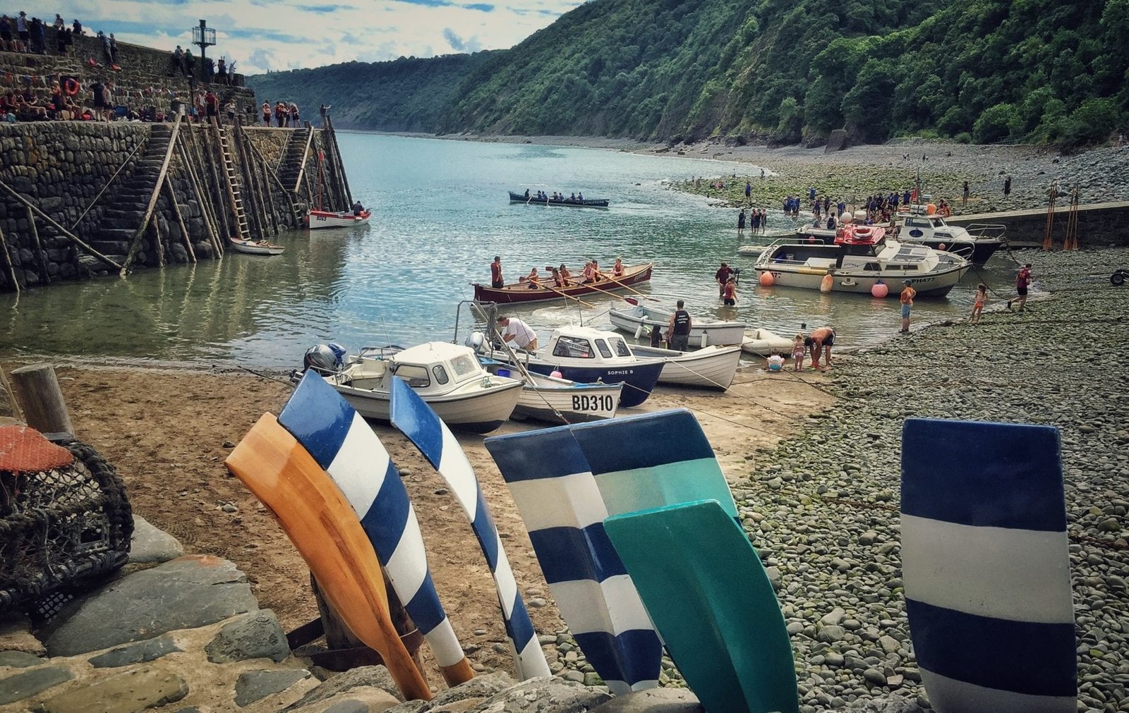 Clovelly harbour fishing boats whitewashed quay