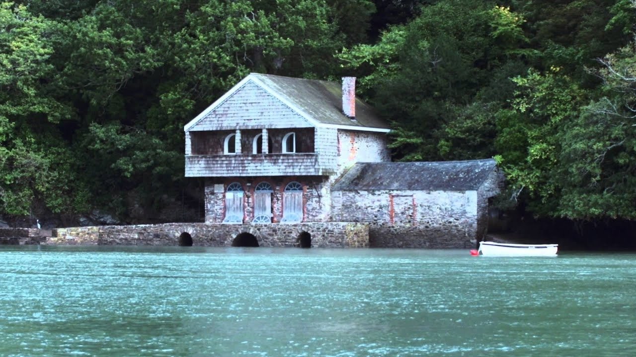 Riverside boathouse and woodland at Greenway