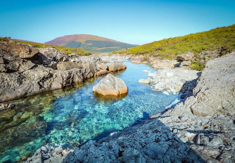 Clear water and waterfall at the Fairy Pools
