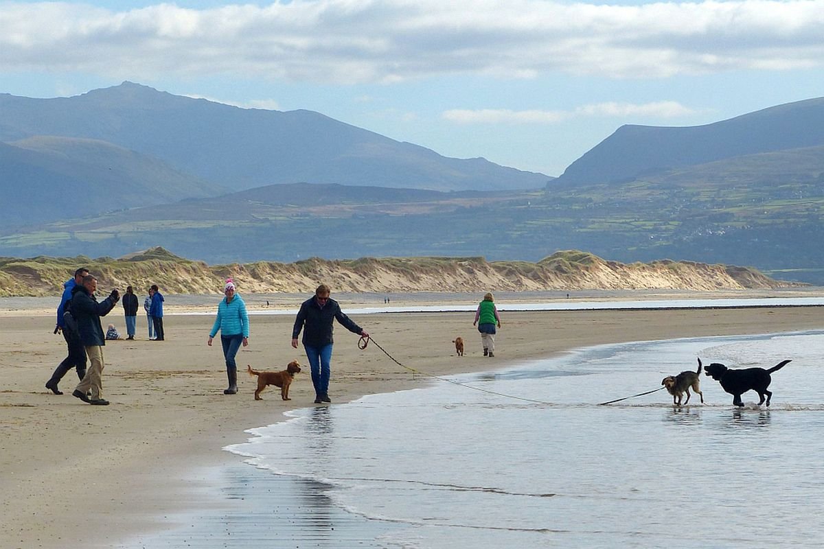 The sandy Llanddwyn Beach with views towards Eryri